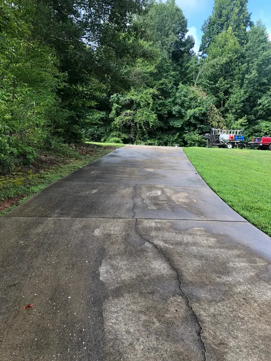 Stained and dirty driveway before pressure washing