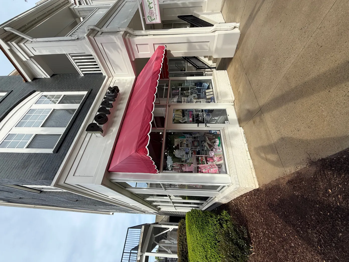 Dirty commercial storefront before pressure washing