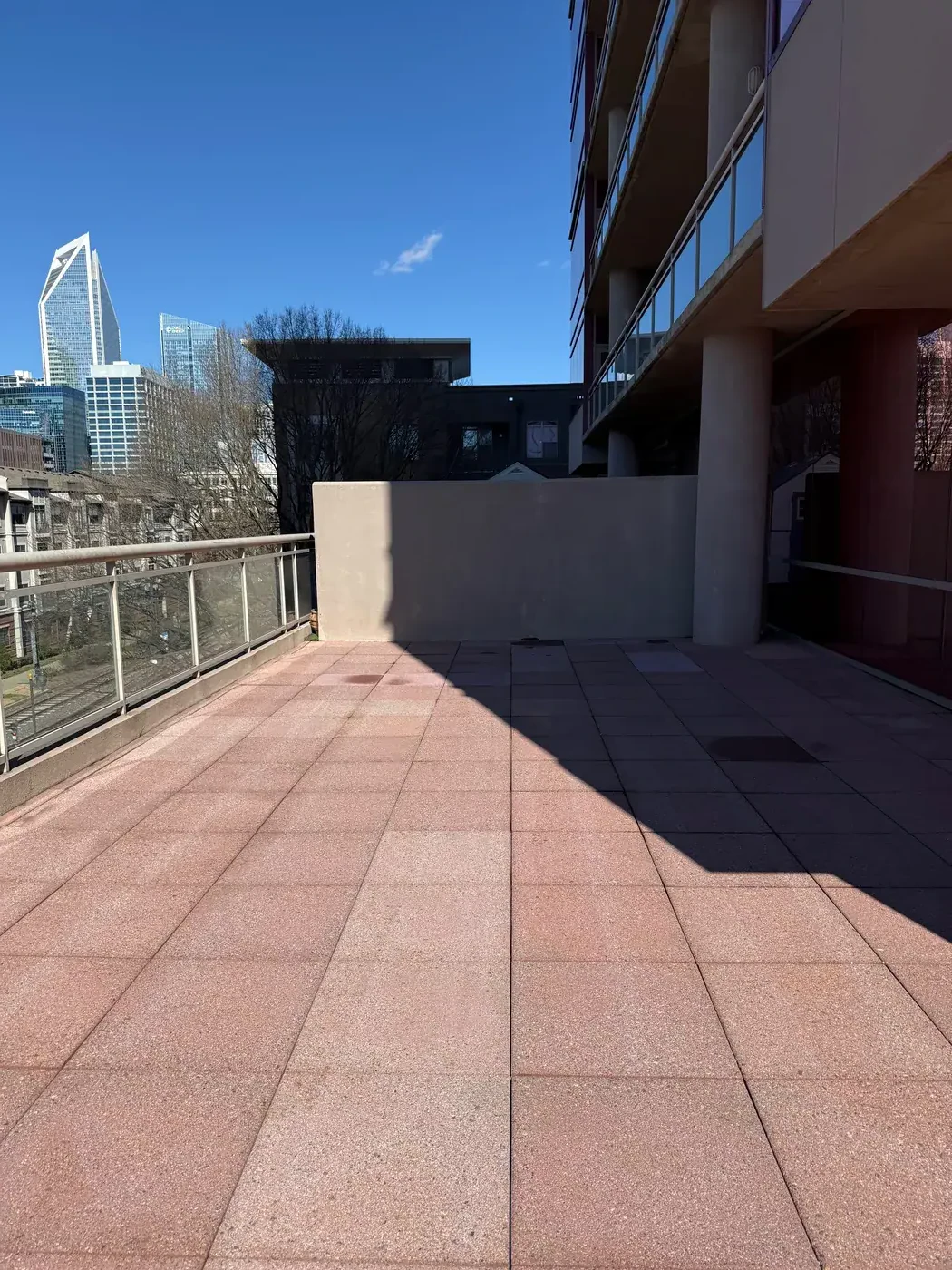 Dirty commercial rooftop terrace before pressure washing