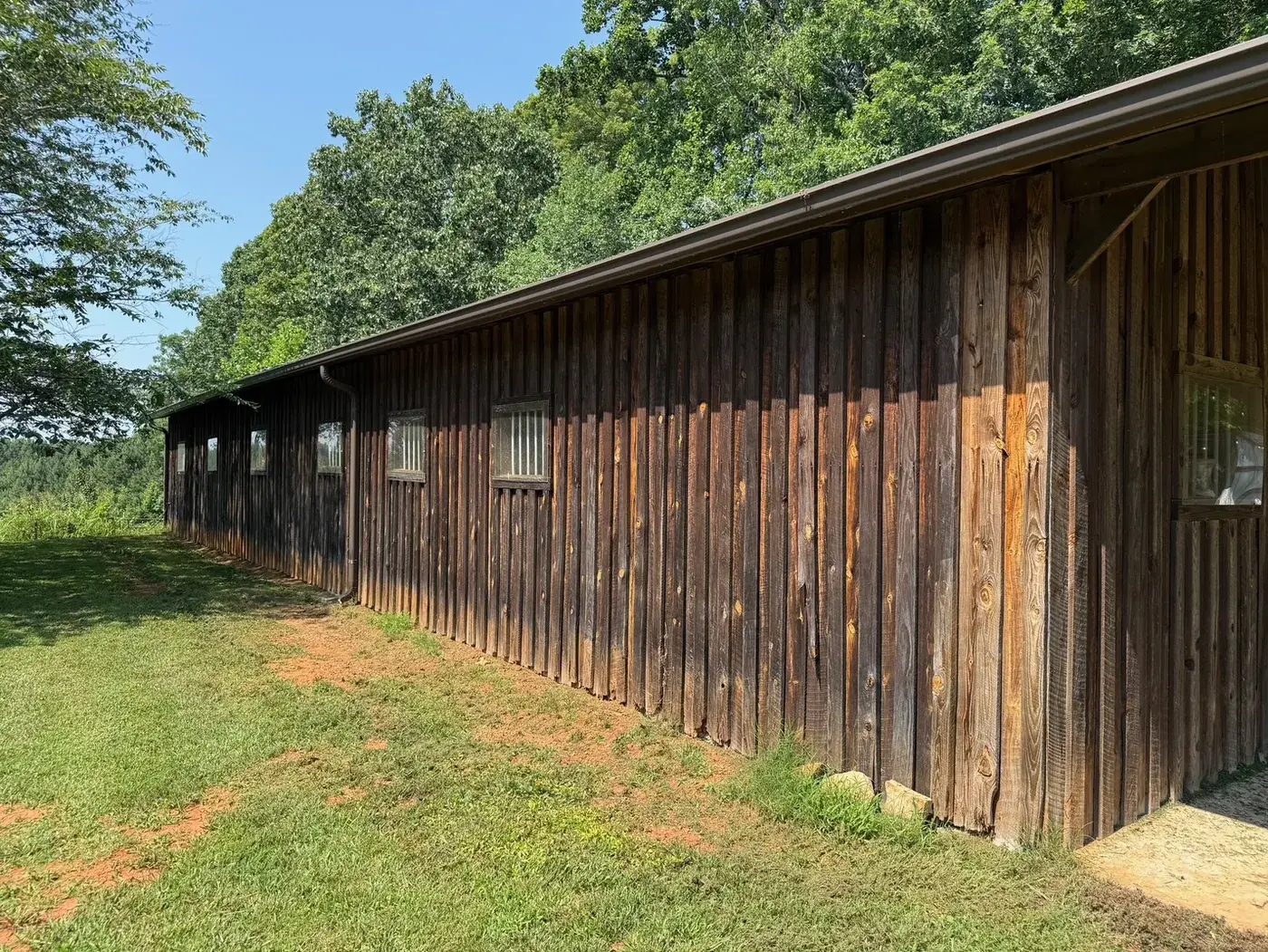 Dark weathered barn wood before pressure washing