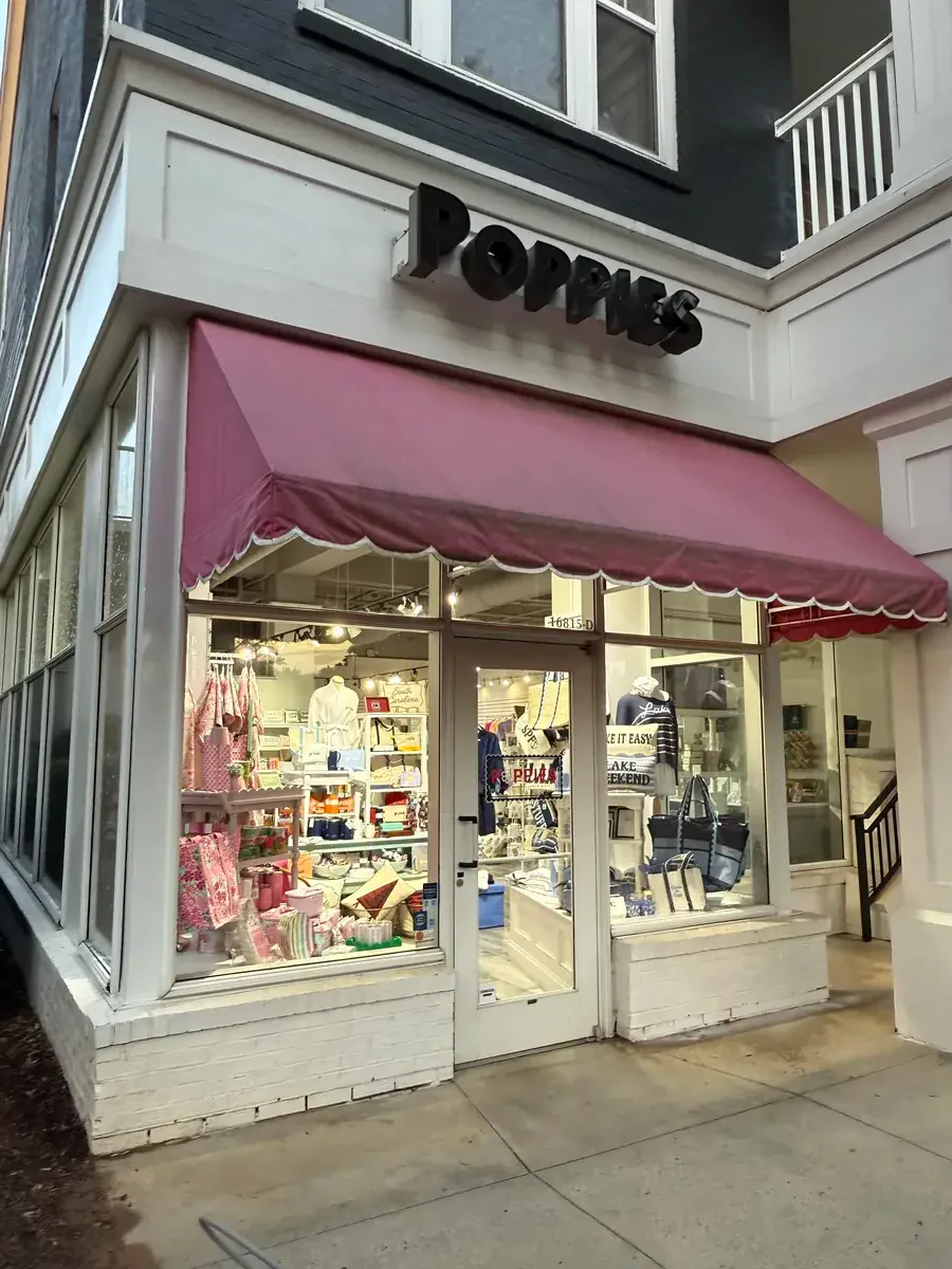 Dirty commercial storefront before pressure washing